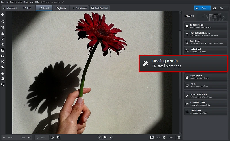 Open your picture with PhotoWorks and select the Healing Brush tool